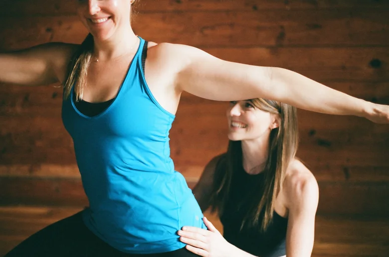 Teacher guiding a student's extended arm
