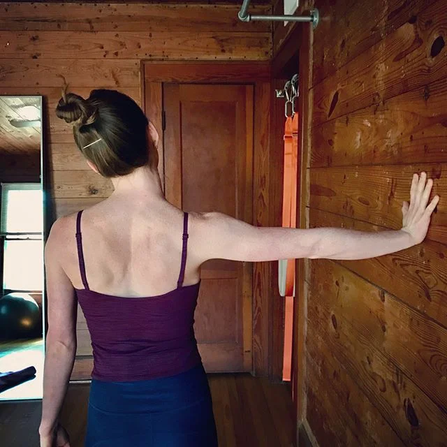 Nerve stretch with the palm pressed into the wall