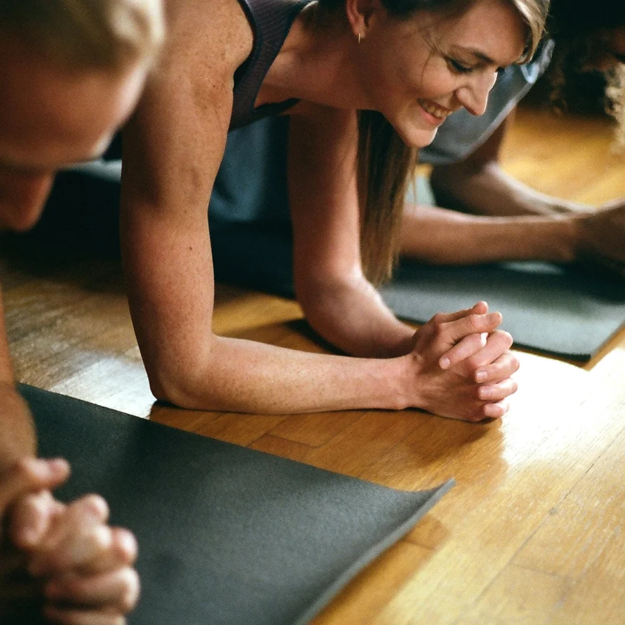 Students in forearm plank during a semi-private class